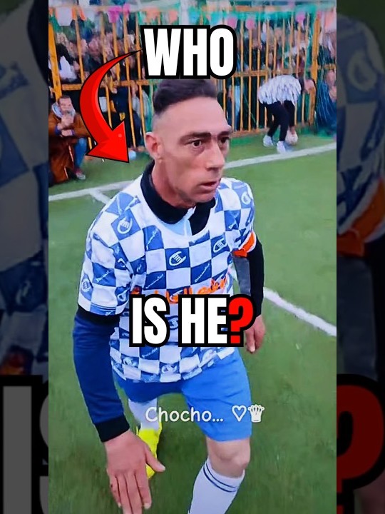 Choucha in a blue checkerboard kit with the caption Who is he
